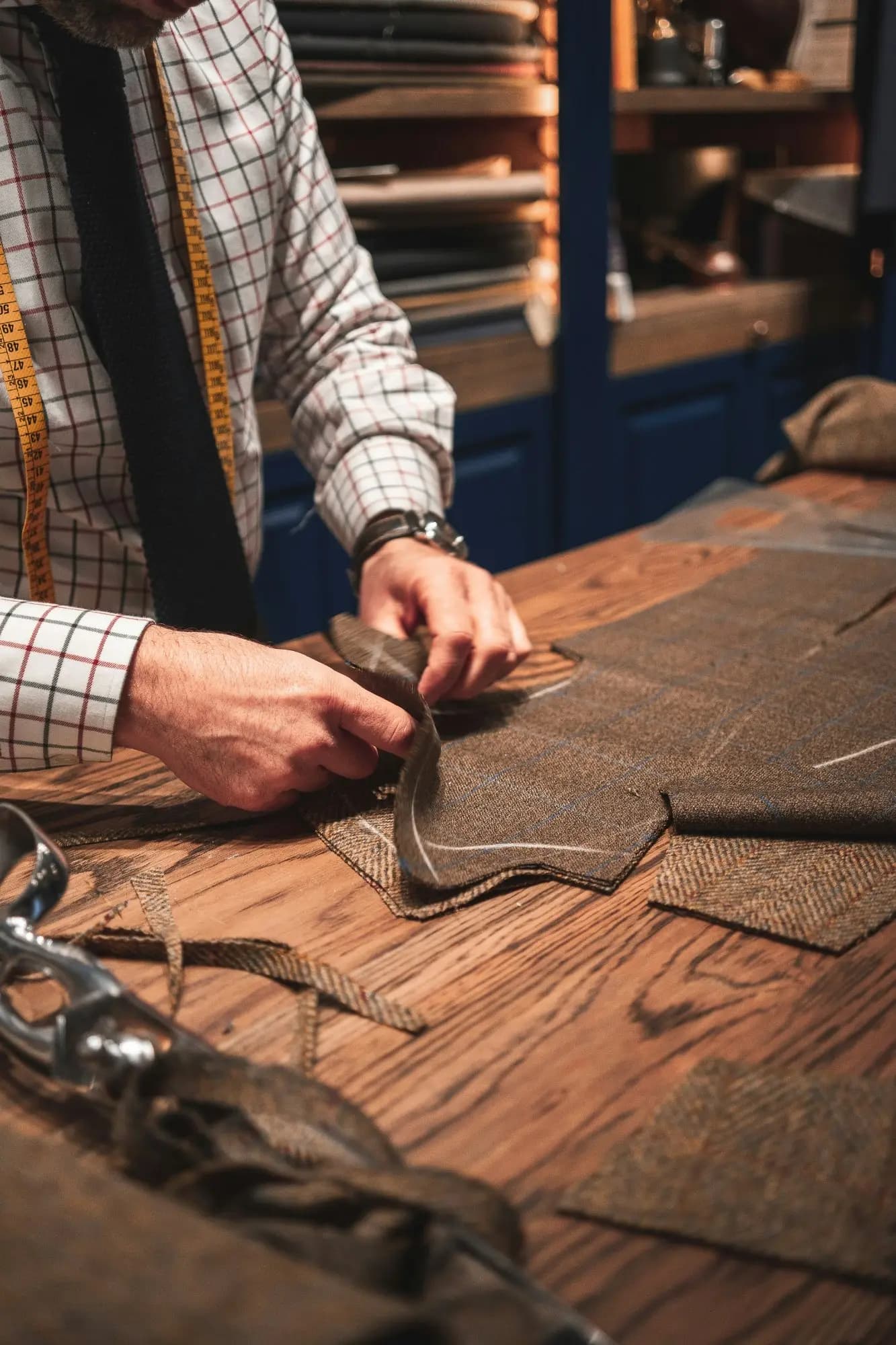 Expert tailor crafting bespoke garments at Enoch Tailor Shop, Arlington Heights IL